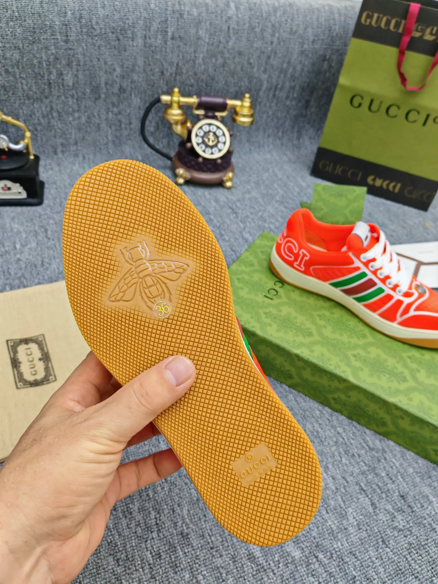 Factory price 600💰Screener series embellished web sneakers. This item is from the Gucci Lido series. Its design is inspired by the summer style and beach clubs of the Italian coast. The Screener series of sneakers draws inspiration from classic sneakers from the 1970s and takes its name from a special defensive move in sports. This shoe from the 2024 Pre-Fall collection is crafted from yellow rubber, a technical and malleable opaque material, with striped webbing on the sides and an embossed Gucci printed logo on the heel. Yellow rubber, opaque and technological in appearance. Red and green webbing decorated with metal Double G oval enamel details. Gucci printed embossed logo. Women 35-40, men 38-45, (men 38 and 45 need to be customized)